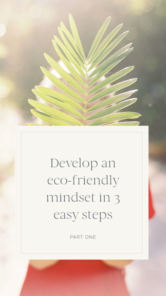 Woman holding large plant in front of her face with the text "Develop an eco-friendly mindset in 3 easy steps".
