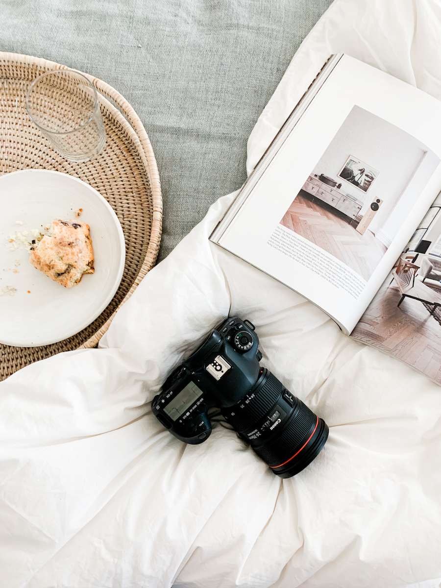Camera and book on bed
