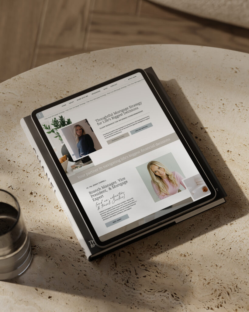 Jenny Farrell's classy and modern website displayed on an ipad sitting on table next to a glass.