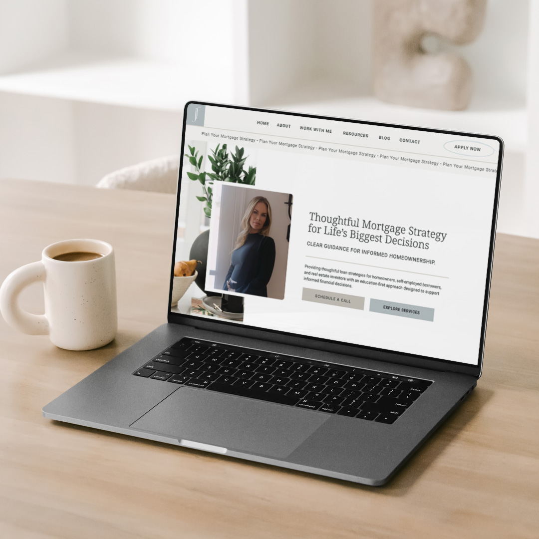 Jenny Farrell's modern and cozy website displayed on a laptop sitting on a table next to a mug of coffee.